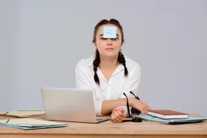 young-beautiful-businesswoman-sitting-with-sticker-forehead-workplace_20260213_120917