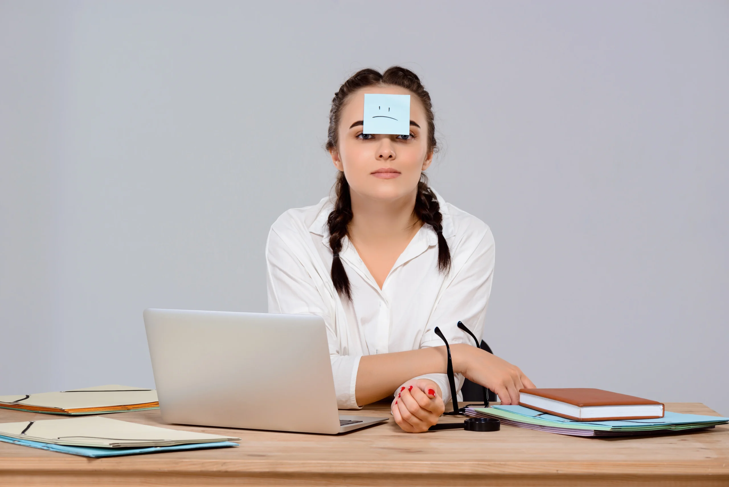 young-beautiful-businesswoman-sitting-with-sticker-forehead-workplace_20260213_120917
